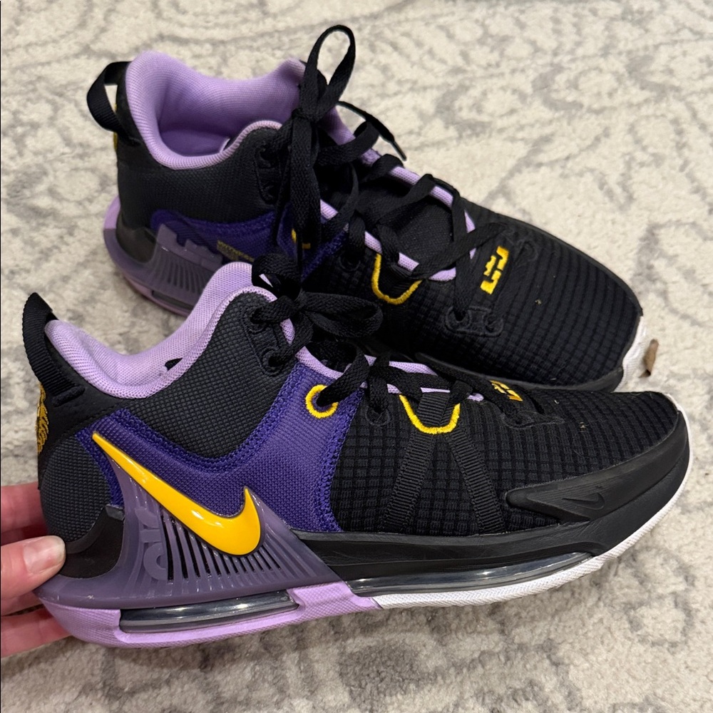 Black and Purple Athletic Sneakers with Yellow Accents Nike LeBron